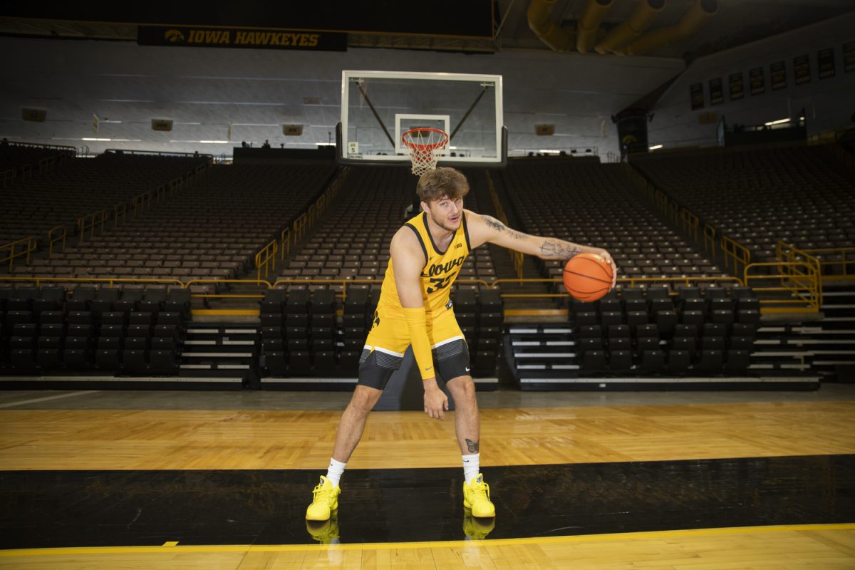 Iowa forward Owen Freeman poses for a portrait during men’s basketball media day at Carver-Hawkeye Arena in Iowa City on Monday, Oct. 7, 2024. The team took interviews from the media and held an open practice.