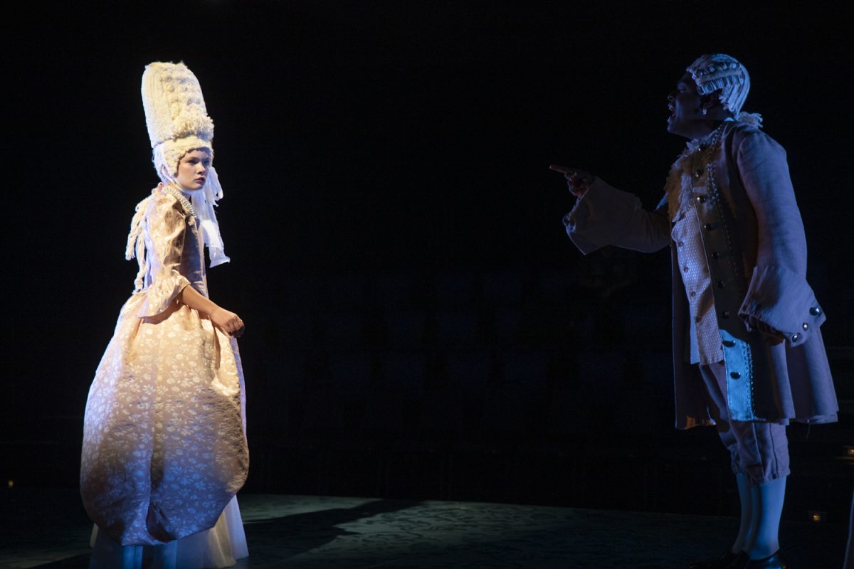 Marie Antoinette played by Alice Conroy is berated by her brother played by Brennen Savon Malone during a dress rehearsal of Marie Antoinette inside the David Thayer Theatre at the UI Theatre Building on Wednesday, Oct. 9, 2024. Marie Antoinette is written by David Adjmi and directed by Mary Beth Easley.