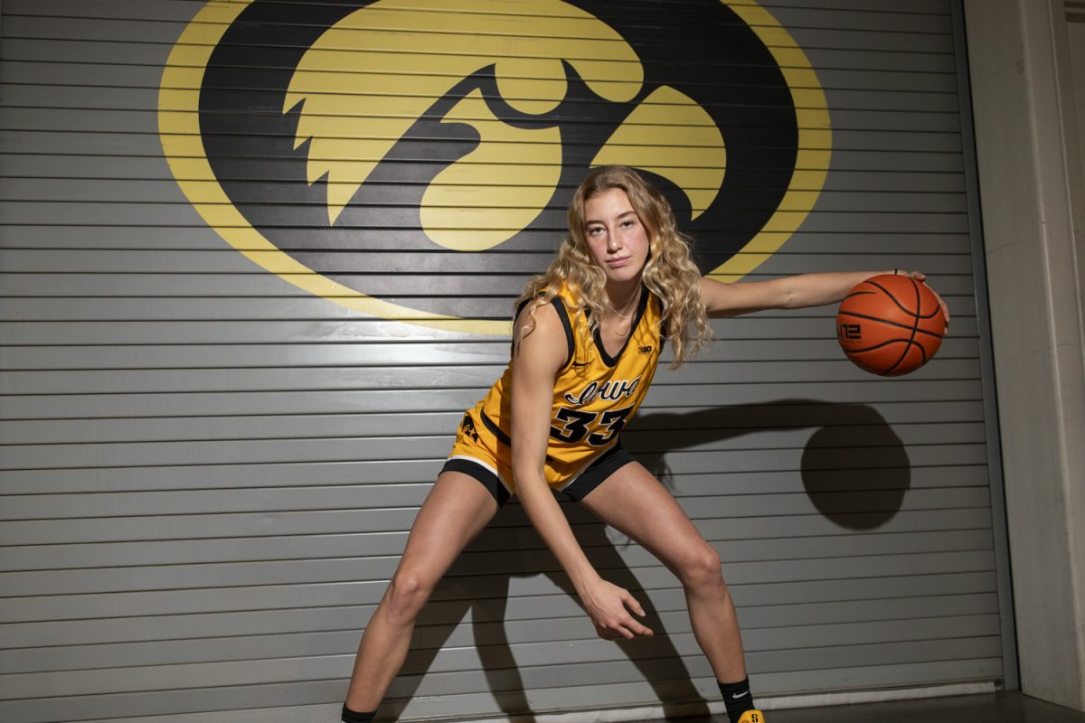 Iowa guard Lucy Olsen poses for a portrait during Iowa women’s basketball media day at Carver-Hawkeye Arena in Iowa City on Thursday, Oct. 10, 2024. The players took photos and answered questions from the media.