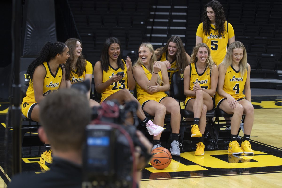 The Iowa women’s basketball team interact with each other during media day at Carver-Hawekeye Arena in Iowa City on Oct. 10. The players took photos and answered questions from the media.