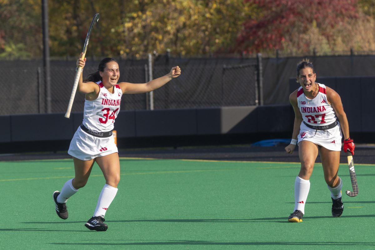 Inés Garcia Prado (34) and Theresa Ricci (27) celebrate the Hoosier's game winning goal during a field hockey game between No. 12 Iowa and Indiana at Grant Field in Iowa City on Friday, Oct. 11, 2024. The Hoosiers defeated the Hawkeyes 2-1 in double overtime.