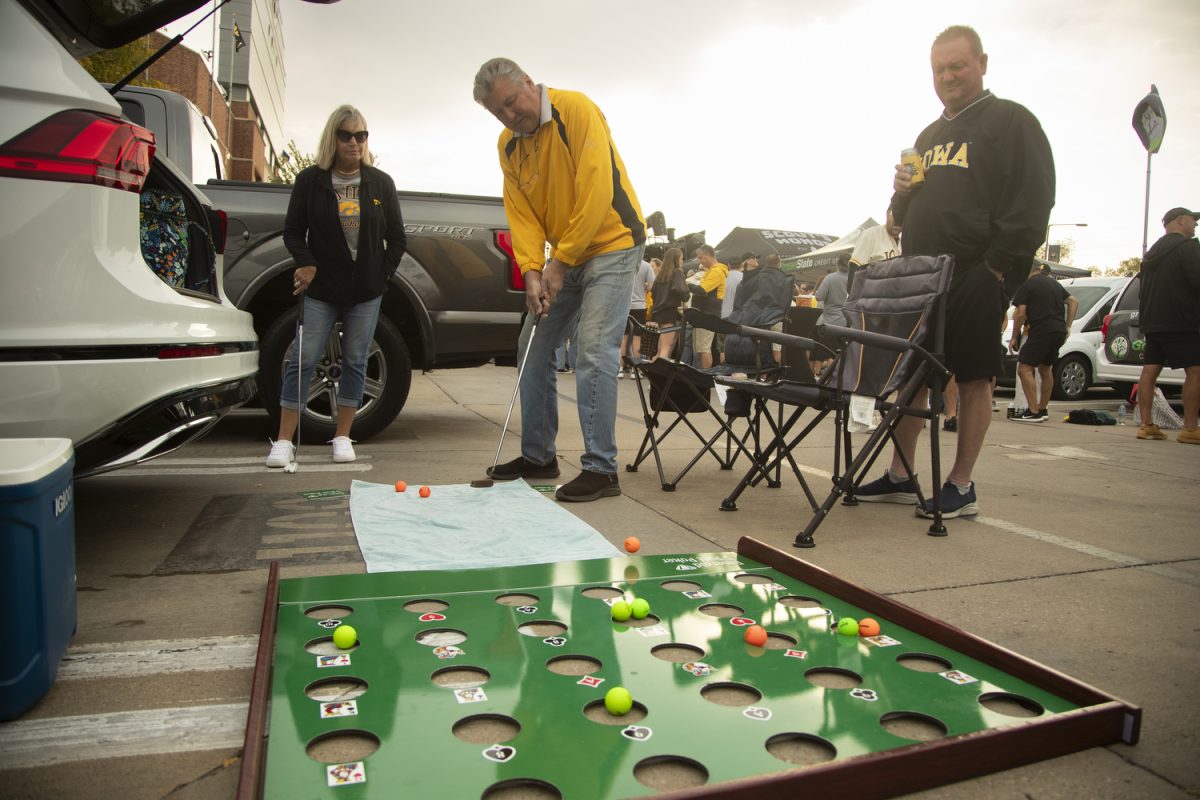 Randy Rohlfsen plays put poker  before a football game between Washington and Iowa at Kinnick Stadium in Iowa City on Saturday, Oct. 12, 2024. The Hawkeyes defeated the Huskies 40-16. 