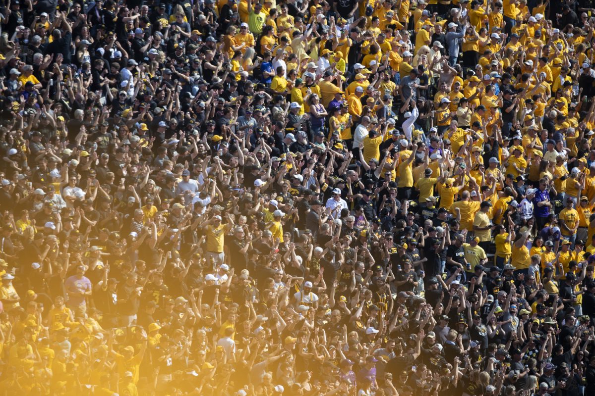 Fans cheer after Iowa wide receiver Dayton Howard scores a touchdown during a football game between Iowa and Washington at Kinnick Stadium in Iowa City on  Saturday, Oct. 12, 2024.  The Hawkeyes defeated the Huskies 40-16.