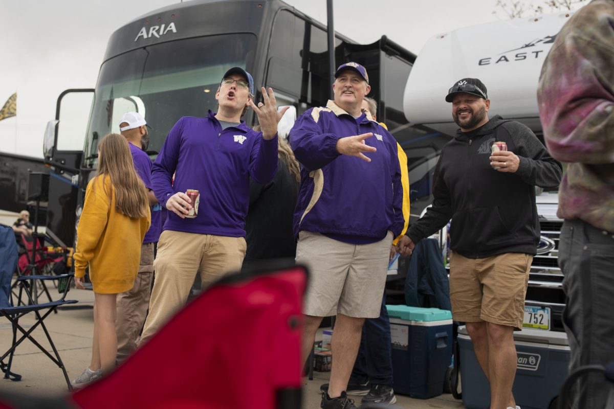 Washington fans tailgate before a football game between Washington and Iowa at Kinnick Stadium in Iowa City on Saturday, Oct. 12, 2024. The Hawkeyes defeated the Huskies 40-16. (Emma Calabro/The Daily Iowan)