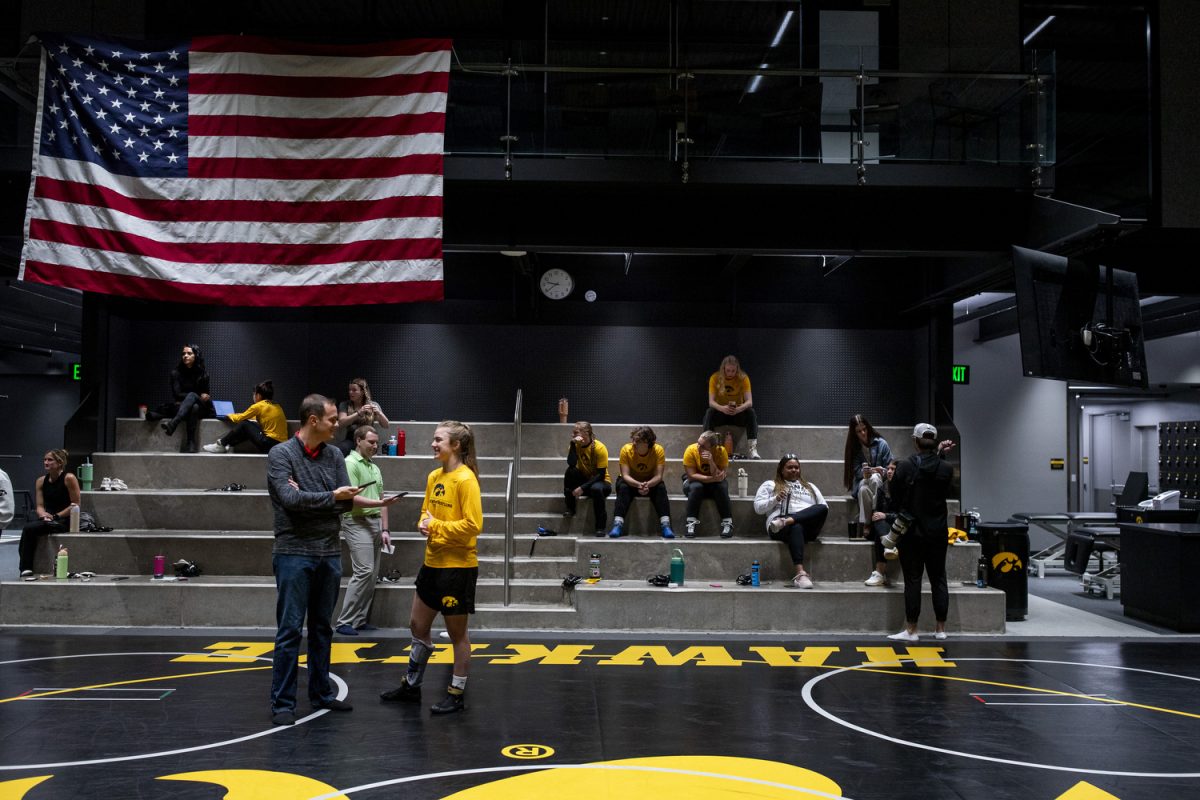 Women’s wrestlers and media members interact during the second annual Iowa women’s wrestling media day at the Goschke Family Wrestling Training Center in Iowa City, on Oct. 15, 2024.