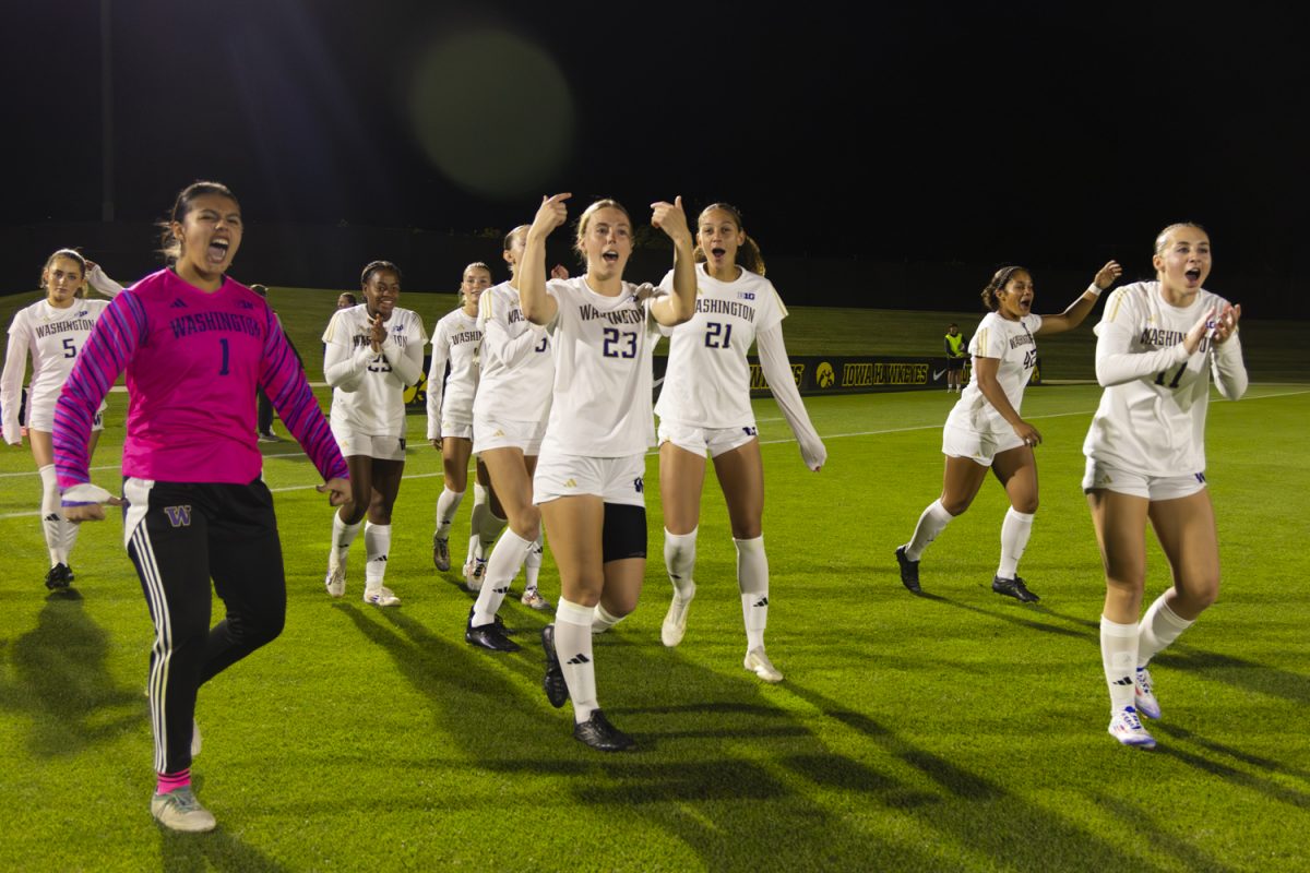 Washington players encourage one another before a women’s soccer game between Iowa and Washington at the University of Iowa Soccer Complex on Thursday, Oct. 17, 2024. The Hawkeyes defeated the Huskies 1-0.