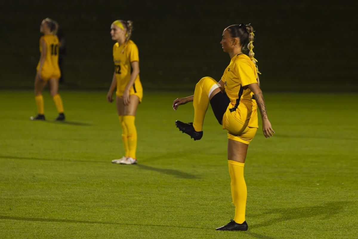 Iowa forward Meike Ingles (14) stretches before the kickoff of a women’s soccer game between Iowa and Washington at the University of Iowa Soccer Complex on Thursday, Oct. 17, 2024. The Hawkeyes defeated the Huskies 1-0.