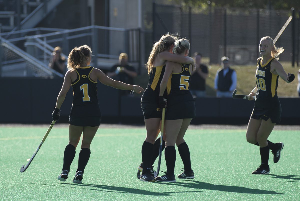 The Iowa field hockey team celebrates a goal during a game between the no. 17 Iowa Hawkeyes and the UC Davis Aggie at Grant Field in Iowa City on Friday, Oct. 18, 2024. The Hawkeyes defeated the Aggies, 5-0.