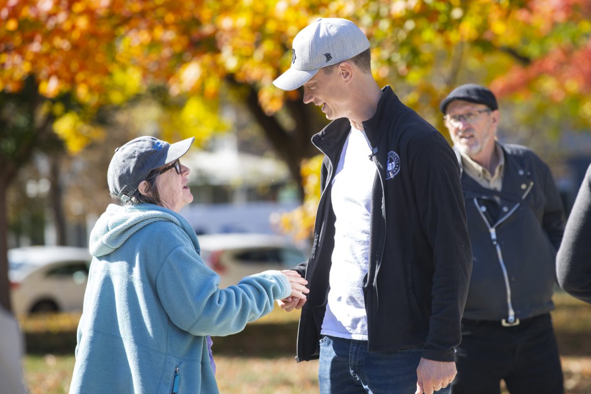 Rob Sand speaks during his 100 Town Halls Tour at College Green Park in Iowa City on Friday, Oct. 18, 2024. At the event, Sand discussed current issues and priorities for the auditor's office and took questions from the public. Sand has been serving as a democratic state auditor since 2019.