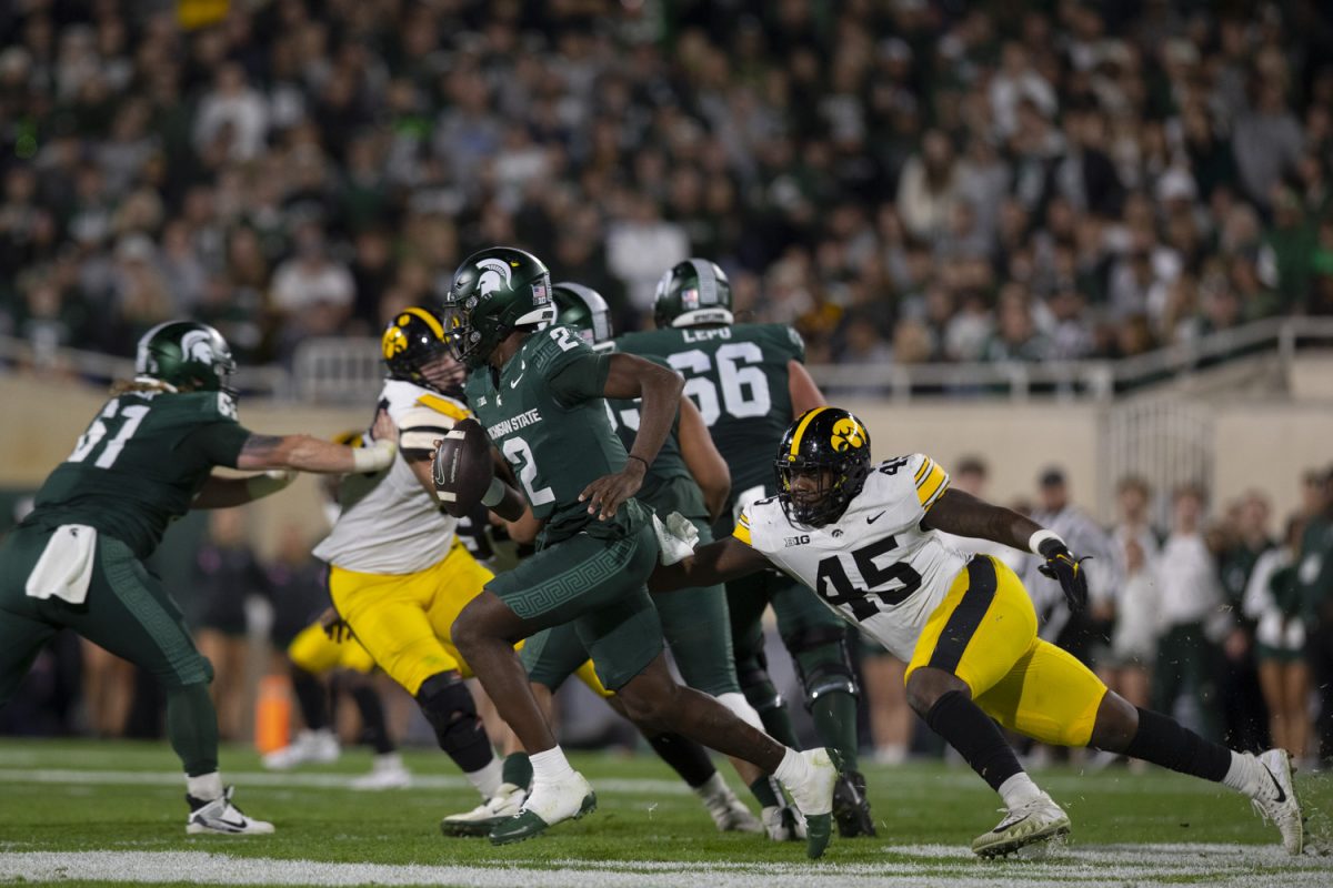 Iowa defensive lineman Deontae Craig tackles Michigan State Quarterback Aidan Chiles during a game between Iowa and Michigan State at Spartan Stadium in East Lansing, Mich., on Saturday, Oct. 19, 2024. The Spartans defeated the Hawkeyes, 32-20.