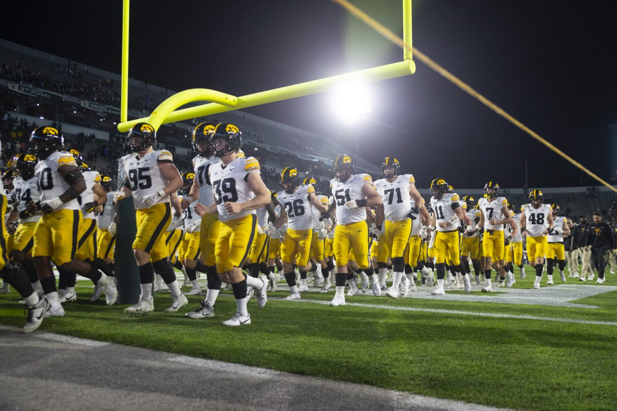 The Hawkeyes run off of the field after a game between Iowa and Michigan State at Spartan Stadium in East Lansing, Mich., on Saturday, Oct. 19, 2024. The Spartans defeated the Hawkeyes, 32-20.