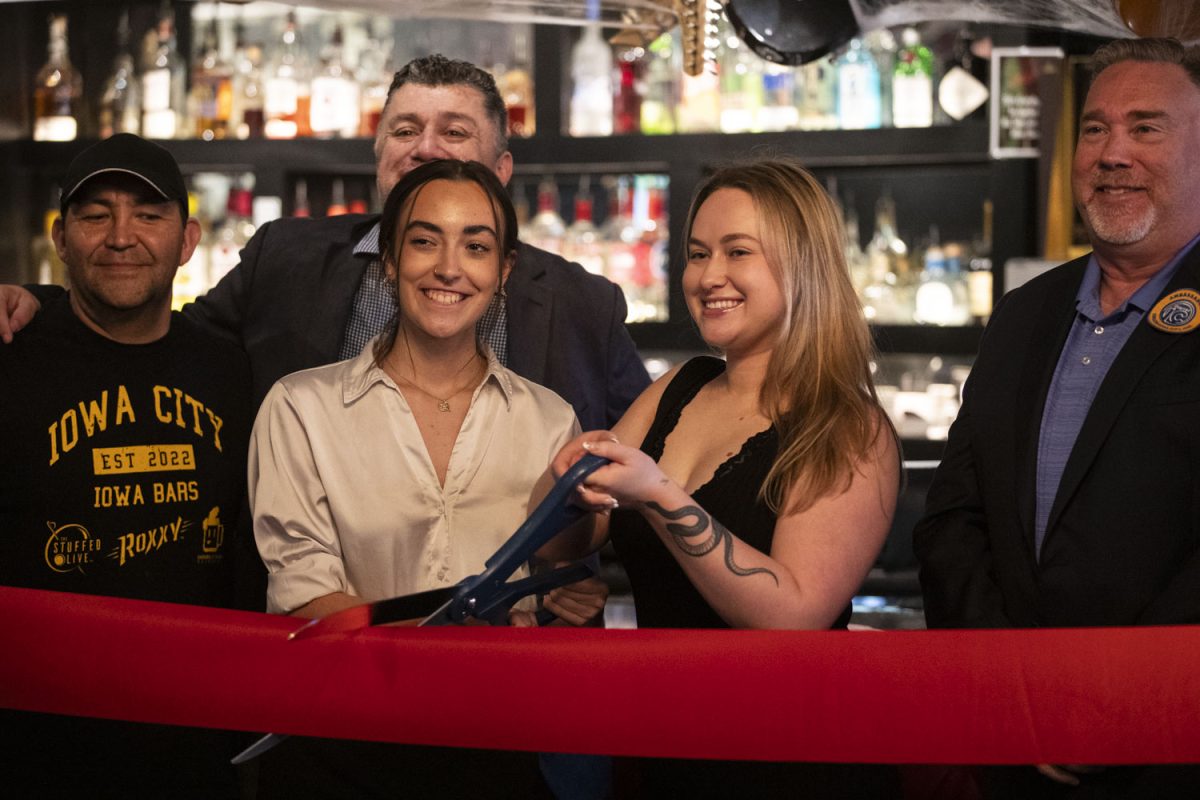 Staff at Roxxy pose for a portrait during a ribbon cutting event in Iowa City on Tuesday, Oct. 22, 2024. Harmonic Hospitality announced new ownership of the bar.