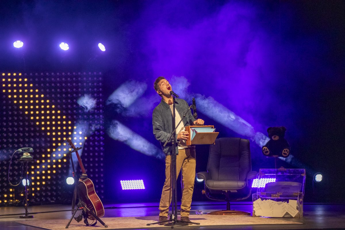 Andy Grammer sings during a performance at the Englert Theatre in Iowa City on Oct. 23. Grammer read poetry in between each of his songs.