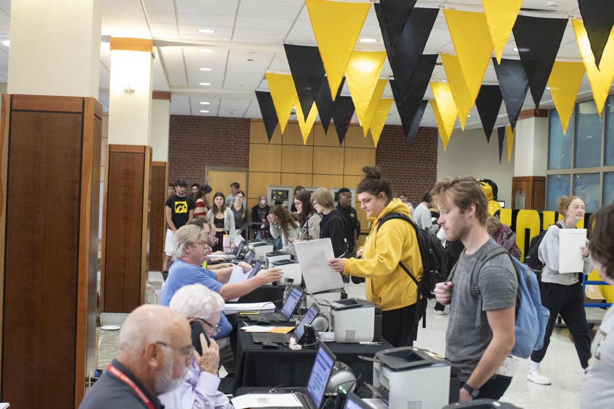 Early voters line up to cast their ballots during early voting at the Iowa Memorial Union on Wednesday, Oct. 23, 2024. Hundreds of students showed up at the IMU for the final day of early voting.