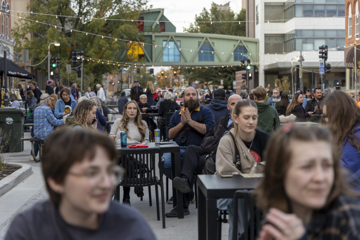 Attendees enjoy live music during the Back to Dubuque Street block party in downtown Iowa City on Thursday, Oct. 24, 2024. The block party celebrated the progress of the Dubuque Street Reconstruction Project and included live music, bingo, drinks, and food. 