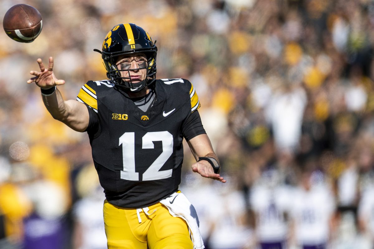 Iowa quarterback Cade McNamara throws the ball during a football game between Iowa and Northwestern at Kinnick Stadium on Saturday, Oct. 26, 2024. McNamara had 73 passing yards. The Hawkeyes defeated the Wildcats, 40-14.