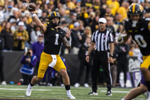 Iowa quarterback Brendan Sullivan throws the ball during a fooball game between Iowa and Northwestern at Kinnick Stadium on Saturday, Oct. 26, 2024. The Hawkeyes defeated the Wildcats 40-14.