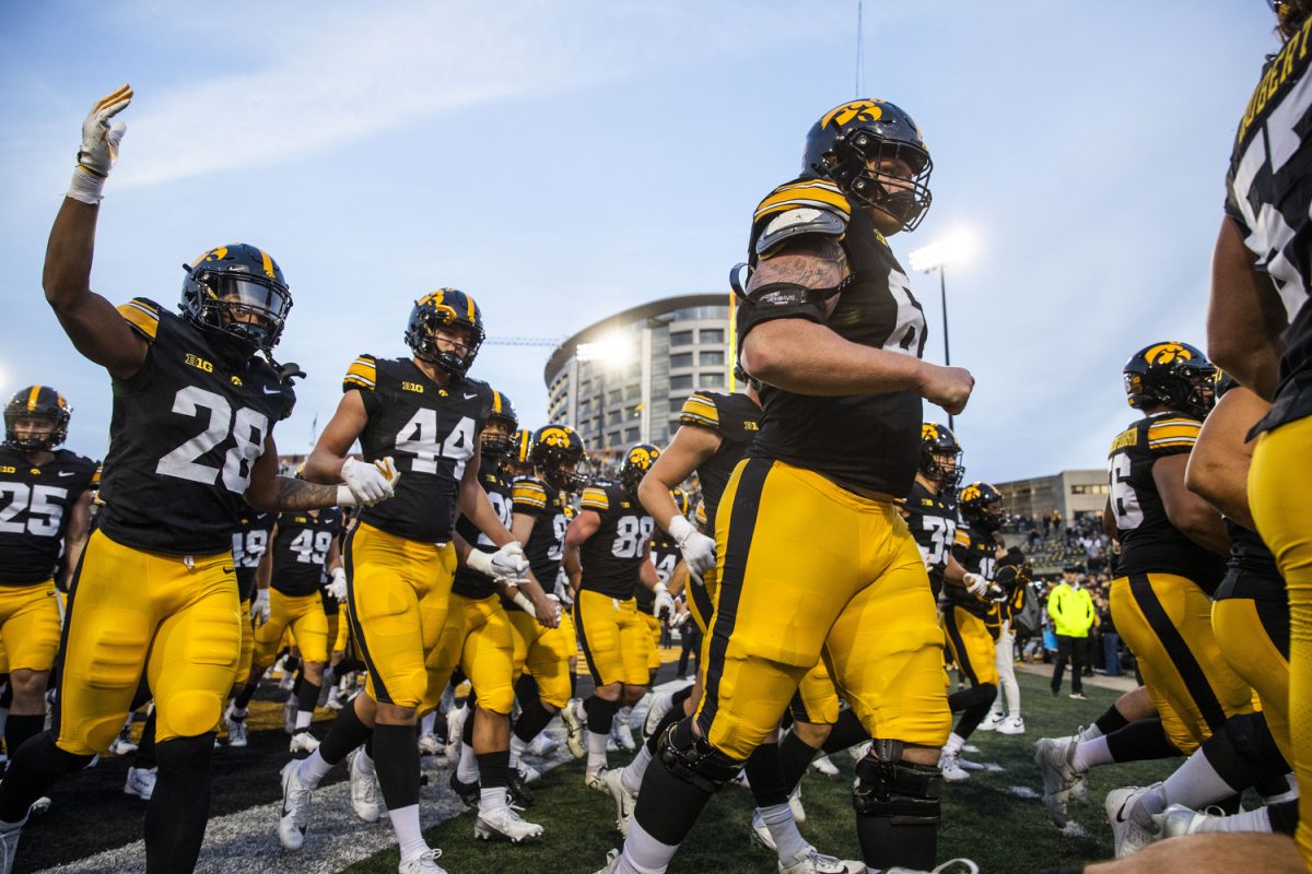 Iowa players walk off the field after a football game between Iowa and Northwestern at Kinnick Stadium on Saturday, Oct. 26, 2024. The Hawkeyes defeated the Wildcats 40-14.