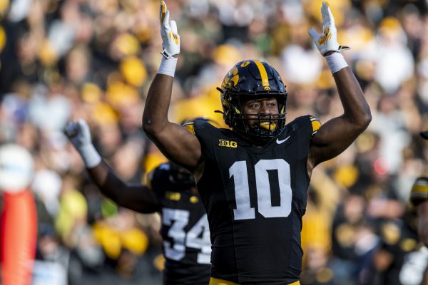 Iowa linebacker Nick Jackson signals a safety during a football game between Iowa and Northwestern at Kinnick Stadium on Saturday, Oct. 26, 2024. The Hawkeyes defeated the Wildcats, 40-14.