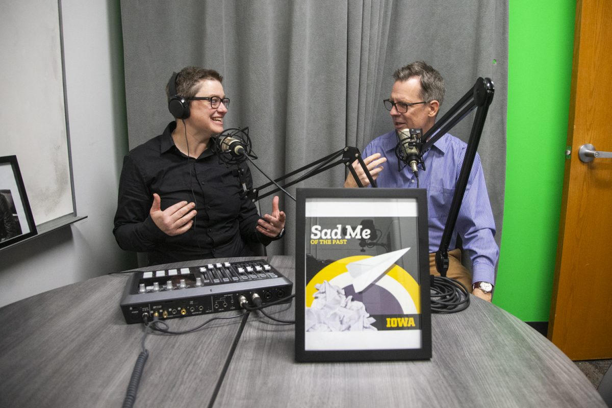 Lauren Haldeman and Stephen Lovely chat during an episode of the podcast Sad Me of the Past in Phillips Hall on Oct. 31. Along with Danny Khalastchi, the three host guests from the Iowa Writer’s Workshop.