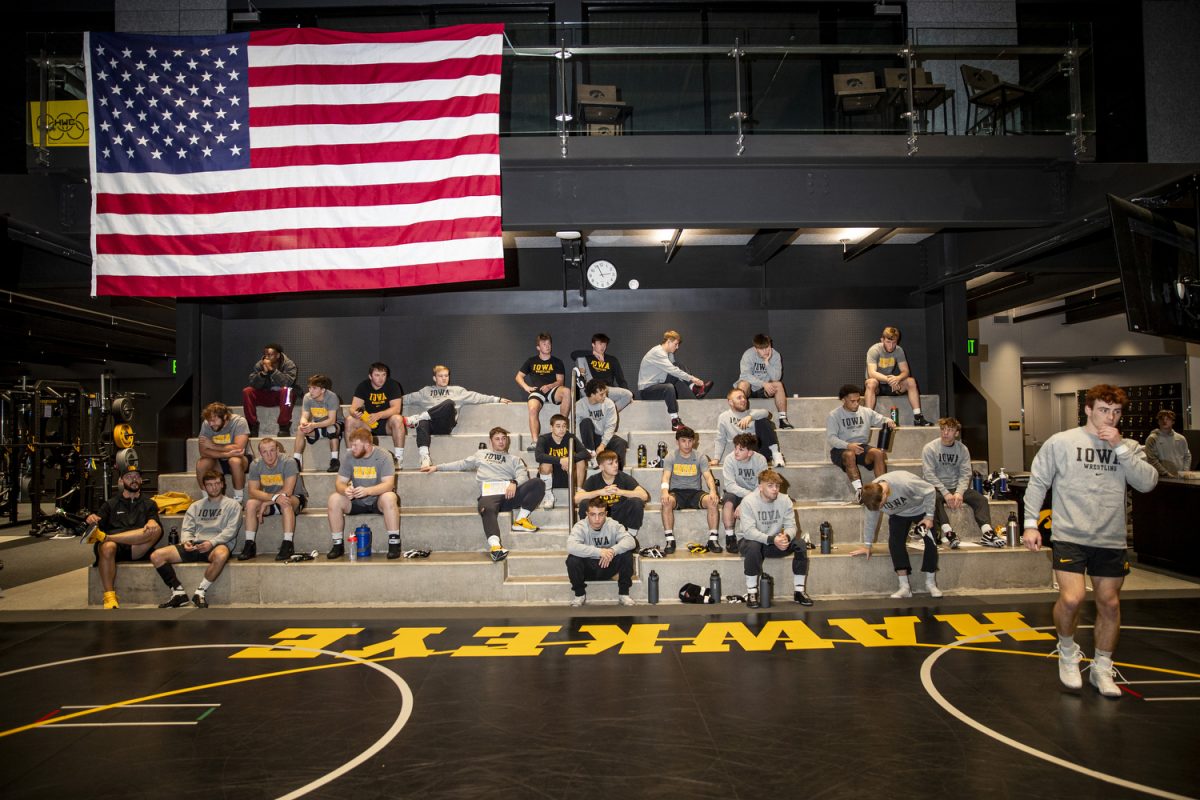 Wrestlers interact with one another during men’s wrestling media day at Carver-Hawkeye Arena in Iowa City, on Thursday Oct. 31, 2024.