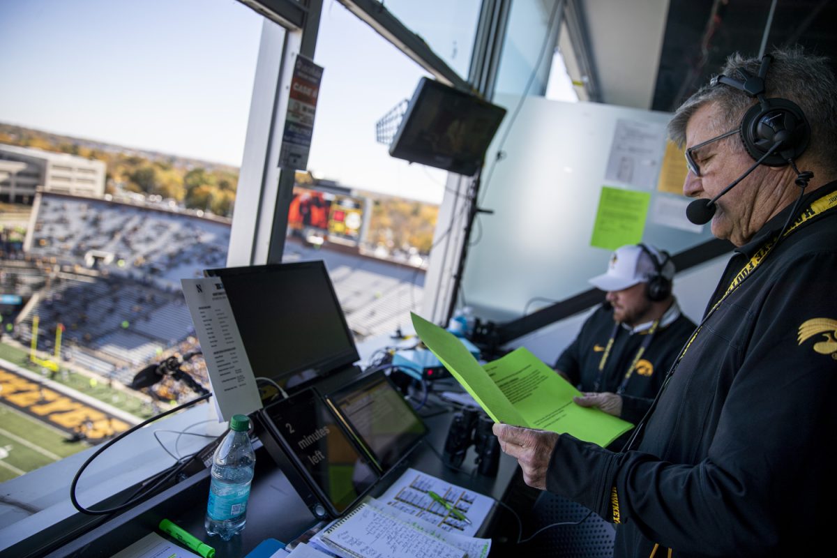 Hawkeye Radio Network’s Gary Dolphin and Pat Angerer do an ad read before a football game between Iowa and Northwestern at Kinnick Stadium on Saturday, Oct. 26, 2024. The Hawkeyes defeated the Wildcats, 40-14.