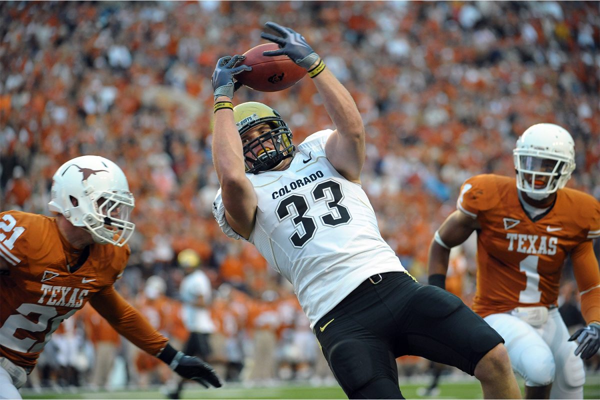 Oct 10, 2009; Austin, TX, USA; Colorado Buffaloes tight end Patrick Devenny (33) catches a pass for a touchdown ahead of Texas Longhorns safety Blake Gideon (21) and linebacker Keenan Robinson (1) during the first half at Texas Memorial Stadium. 