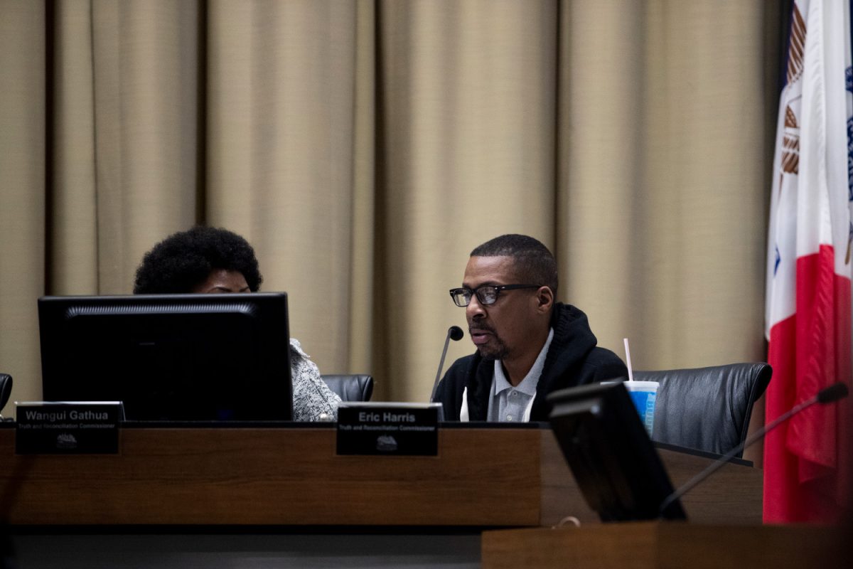 Eric Harris listens to speakers during a Truth and Reconciliation Commission meeting on Thursday, Oct. 6, 2022. Recently, the Iowa Supreme Court recommended the dismissal of three charges against Harris, the former Iowa City commissioner.