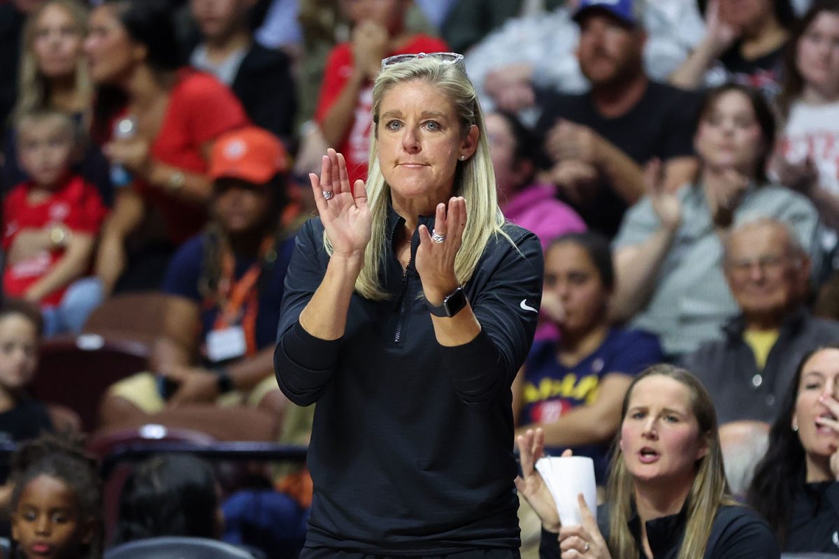 Sep 25, 2024; Uncasville, Connecticut, USA; Indiana Fever head coach Christie Sides reacts during the first half against the Connecticut Sun during game two of the first round of the 2024 WNBA Playoffs at Mohegan Sun Arena. Mandatory Credit: Paul Rutherford-Imagn Images