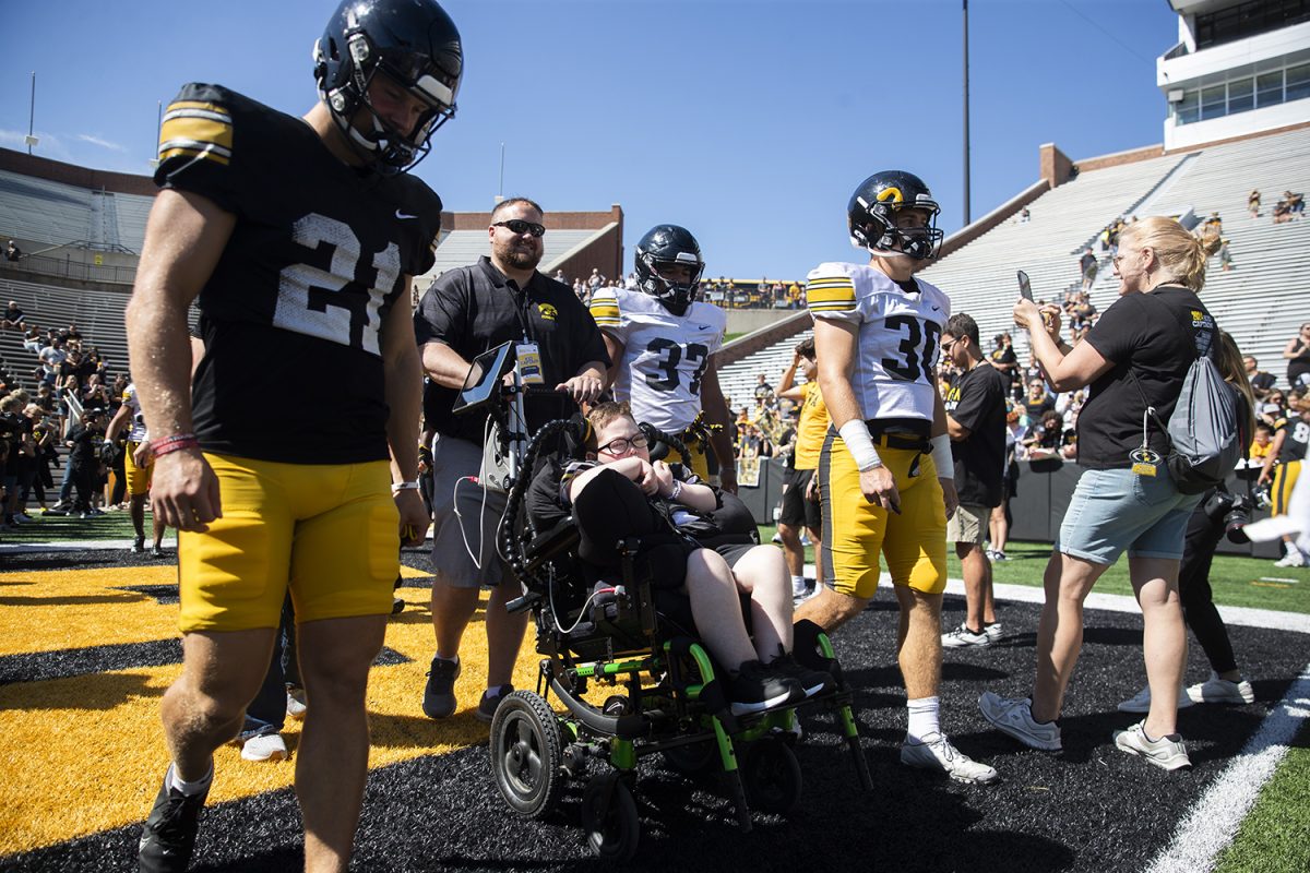 Kid captain Jackson Casteel participates in the Swarm during Kids Day at Kinnick on Aug. 10, 2024. Casteel was diagnosed at six weeks with hondrodysplasia Punctata X-Linked Recessive Type 1. 