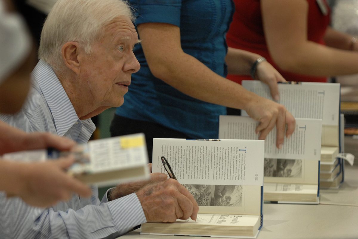 Oct. 10, 2007: Former United States President Jimmy Carter signs copies of his new book at the Costco store off Gate Parkway.