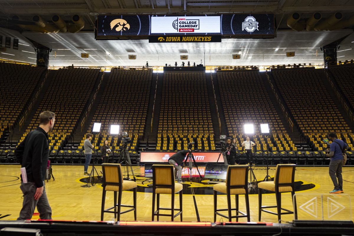 ESPN crew members set up lights during College Gameday before a basketball game between No. 6 Iowa and No. 2 Ohio State at Carver-Hawkeye Arena on Sunday, March 3, 2024. The Hawkeyes defeated the Buckeyes, 93-83. (Ayrton Breckenridge/The Daily Iowan)