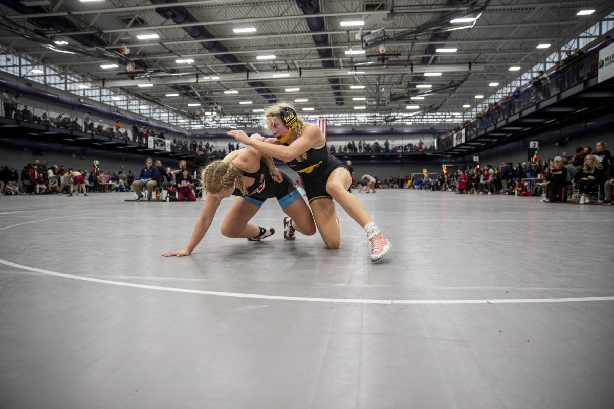 Iowa 145-pound Ella Schmit wrestles grand view Haidyn Snyder during the Luther Hill Open Titles at the Blake Field House in Indianola, Iowa, on Saturday, Nov. 2, 2024. Iowa ended the tournament with six champions and an overall record of 58-17. (Cody Blissett/The Daily Iowan)