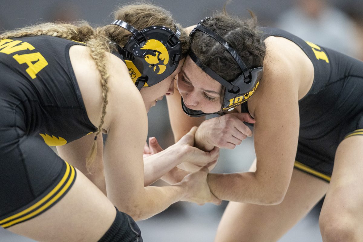 Iowa 131-pound Allie Baudhuin and Iowa 131-pound Emily Frost wrestle during the Luther Hill Open Titles at the Blake Field House in Indianola, Iowa, on Saturday, Nov. 2, 2024. Iowa ended the tournament with six champions and an overall record of 58-17. 