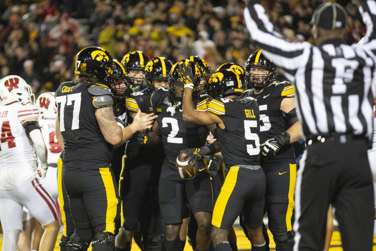 Hawkeyes celebrate after a touchdown by Iowa running back Kaleb Johnson during a football game between Iowa and Wisconsin at Kinnick Stadium on Nov. 2. The Hawkeyes defeated the Badgers 42-10.(Emma Calabro/The Daily Iowan)