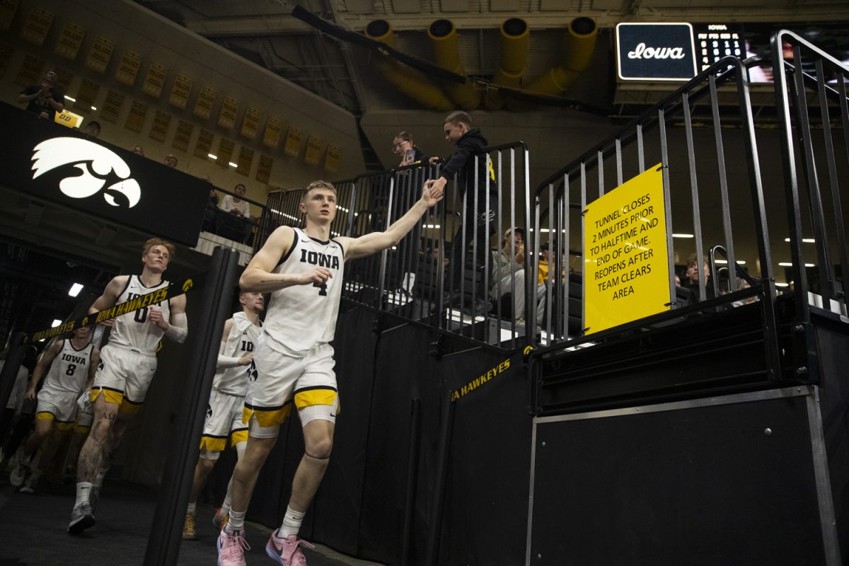 Iowa guard Josh Dix and teammates run out of the tunnel after halftime during an Iowa mens basketball game against Texas A&M Commerce at Carver-Hawkeye Arena in Iowa City on Monday, Nov 4, 2024. Dix put up 10 points and logged 3 assists on Monday against the Lions. The Hawkeyes defeated the Lions 89-67.