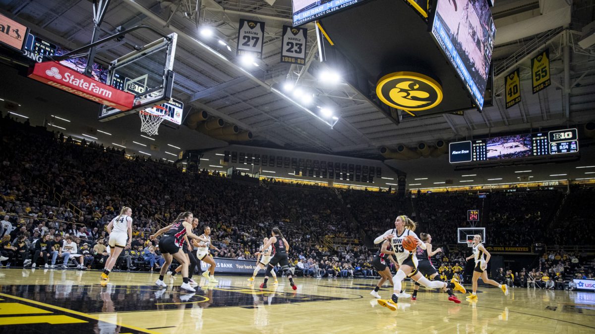 Iowa guard Lucy Olsen drives to the basket during a women’s basketball game between Iowa and Northern Illinois at Carver-Hawkeye Arena in Iowa City on Wednesday, Nov. 6, 2024. Olsen had 19 points, seven assists, and four rebounds. The Hawkeyes defeated the Huskies 91-73.