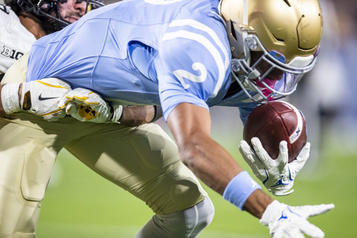 UCLA wide receiver Titus Mokiao-Atimalala catches the ball in the end zone during a football game between Iowa and UCLA at the Rose Bowl Stadium in Pasadena, Calif. on Friday Nov. 8, 2024.