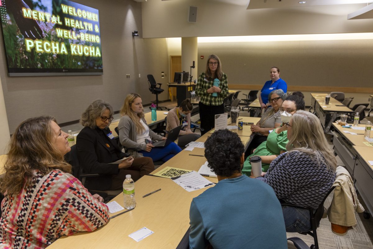 Attendees break into discussion groups during the Pecha Kucha workshop at the University Capital Centre in Iowa City on Thursday, Nov. 7th, 2024. The Obermann Working Group hosted the University of Iowa’s first Mental Health and Well-Being Pecha Kucha. The workshop highlighted on-campus mental health and well-being innovators and was free to the public.