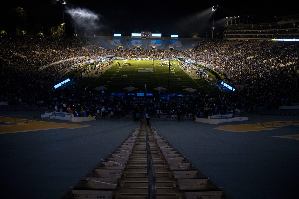 Both teams huddle during a timeout at a football game between Iowa and UCLA at the Rose Bowl Stadium in Pasadena, Calif. on Friday Nov. 8, 2024. The Bruins defeated the Hawkeyes 20-17.