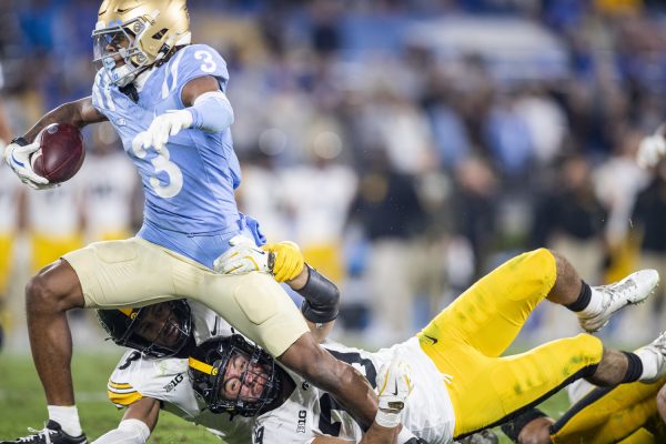 UCLA wide receiver Kwazi Gilmer breaks tackles during a football game between Iowa and UCLA at the Rose Bowl Stadium in Pasadena, Calif. on Friday Nov. 8, 2024. The Bruins defeated the Hawkeyes 20-17.