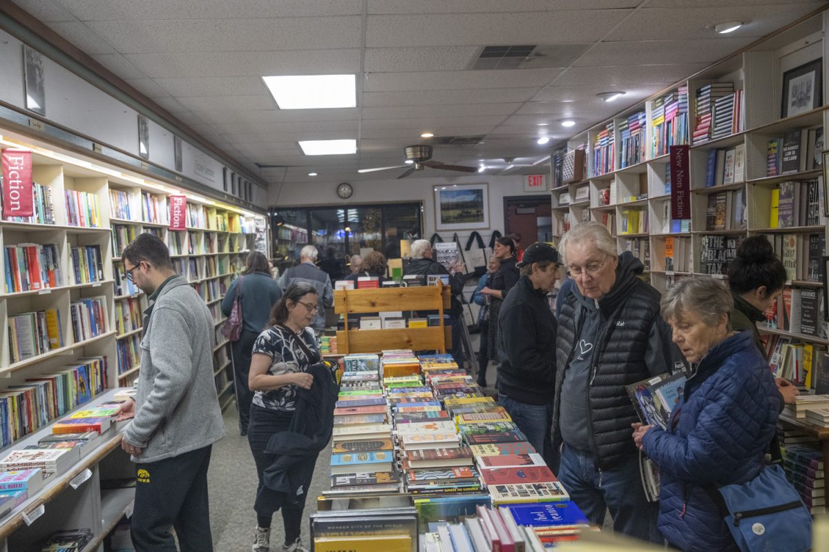 Attendees browse during the 31st Annual Book Gala at Prairie Lights Books and Cafe in Iowa City on Sunday, Nov. 10, 2024. Prairie Lights partnered with the Iowa City Public Library and opened their bookstore after hours for attendees.