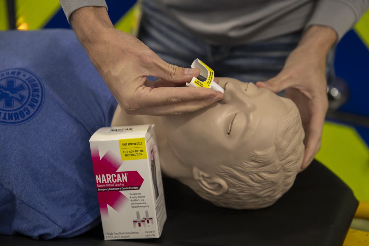 Andreas Wilz, paramedic field operations supervisor, demonstrates the use of Narcan nasal spray on a training mannequin at the Johnson County Ambulance Service in Iowa City on Nov. 10. Naloxene is an emergency medication that can counteract an opioid overdose.