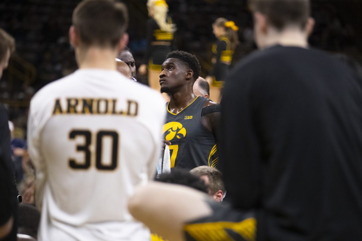 Iowa forward Seydou Traore looks up during a timeout during a men's basketball game between Iowa and South Dakota at Carver-Hawkeye Arena in Iowa City on Tuesday, Nov. 12, 2024. The Hawkeyes defeated the Coyotes 96-77.