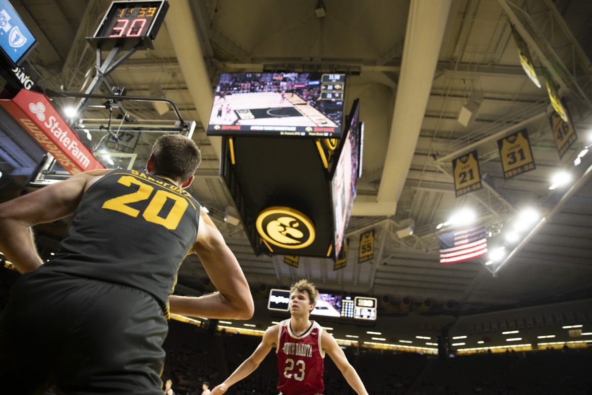 Payton Sandfort looks to pass in the ball during a men’s basketball game between Iowa and South Dakota at Carver Hawkeye Arena in Iowa City on Tuesday, Nov. 12, 2024. The Hawkeyes defeated the Coyotes 96-77.