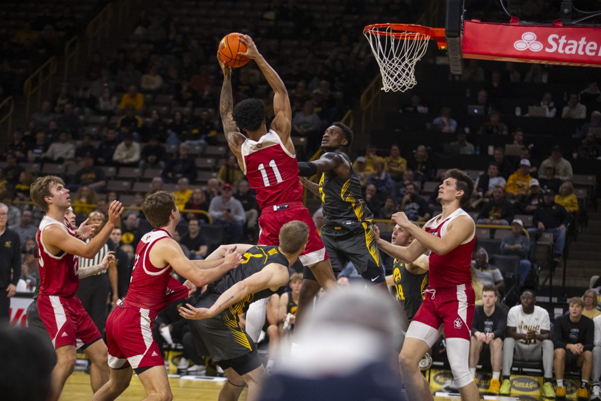 Hawkeyes defend against the Coyotes during a men's basketball game between Iowa and South Dakota at Carver-Hawkeye Arena in Iowa City on Tuesday, Nov. 12, 2024. The Hawkeyes defeated the Coyotes 96-77.