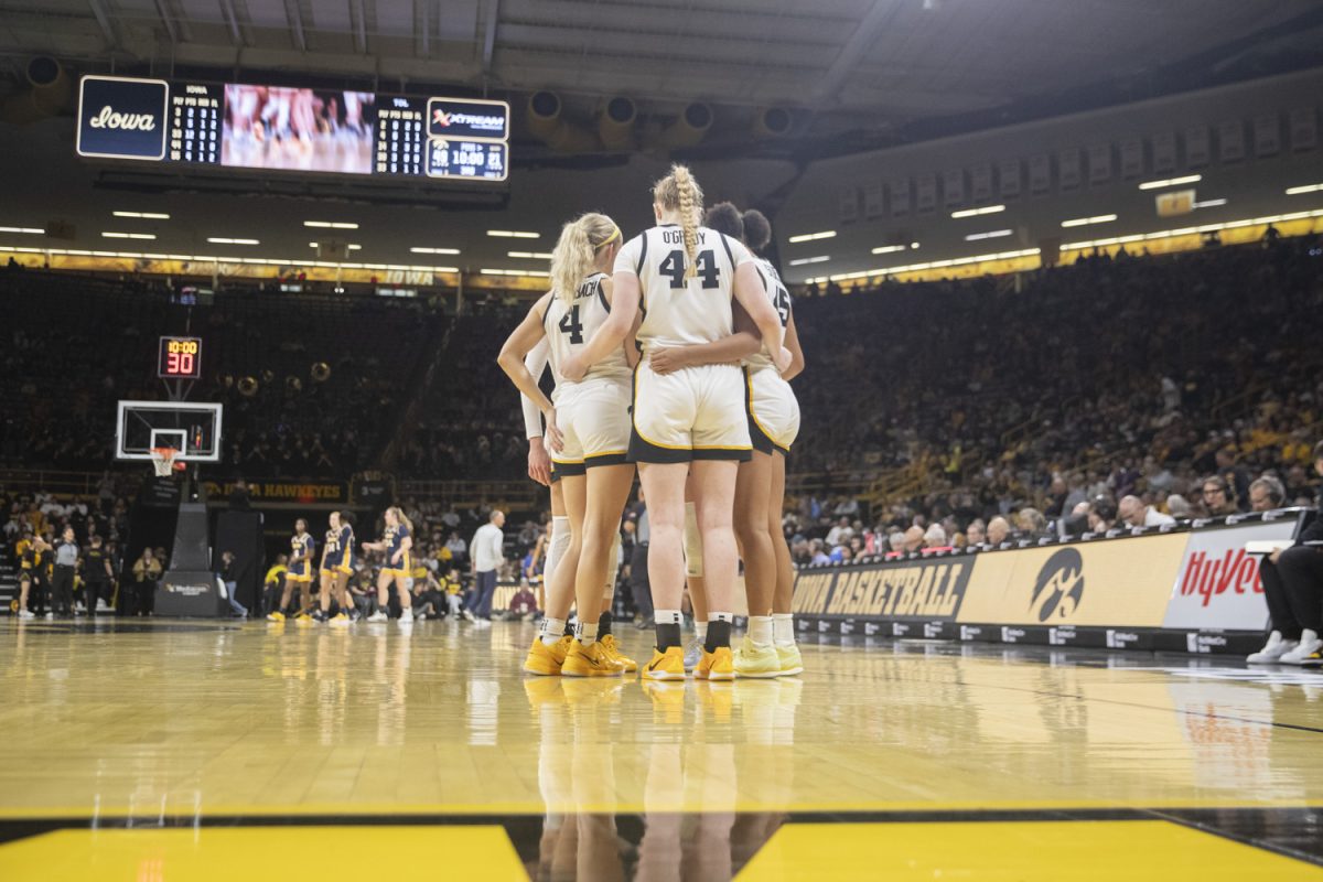 Iowa players huddle after a timeout during an Iowa women’s basketball game at Carver-Hawkeye arena in Iowa City on Wednesday Nov, 13, 2024. The Hawkeyes defeated Toledo 94-57.