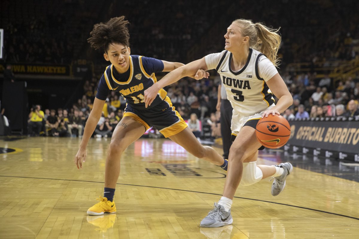 Iowa guard Sydney Affolter drives to the basket guarded by Toledo’s Destiny Robinson during an Iowa women’s basketball game at Carver-Hawkeye arena in Iowa City on Wednesday Nov, 13, 2024. The Hawkeyes defeated Toledo 94-57.