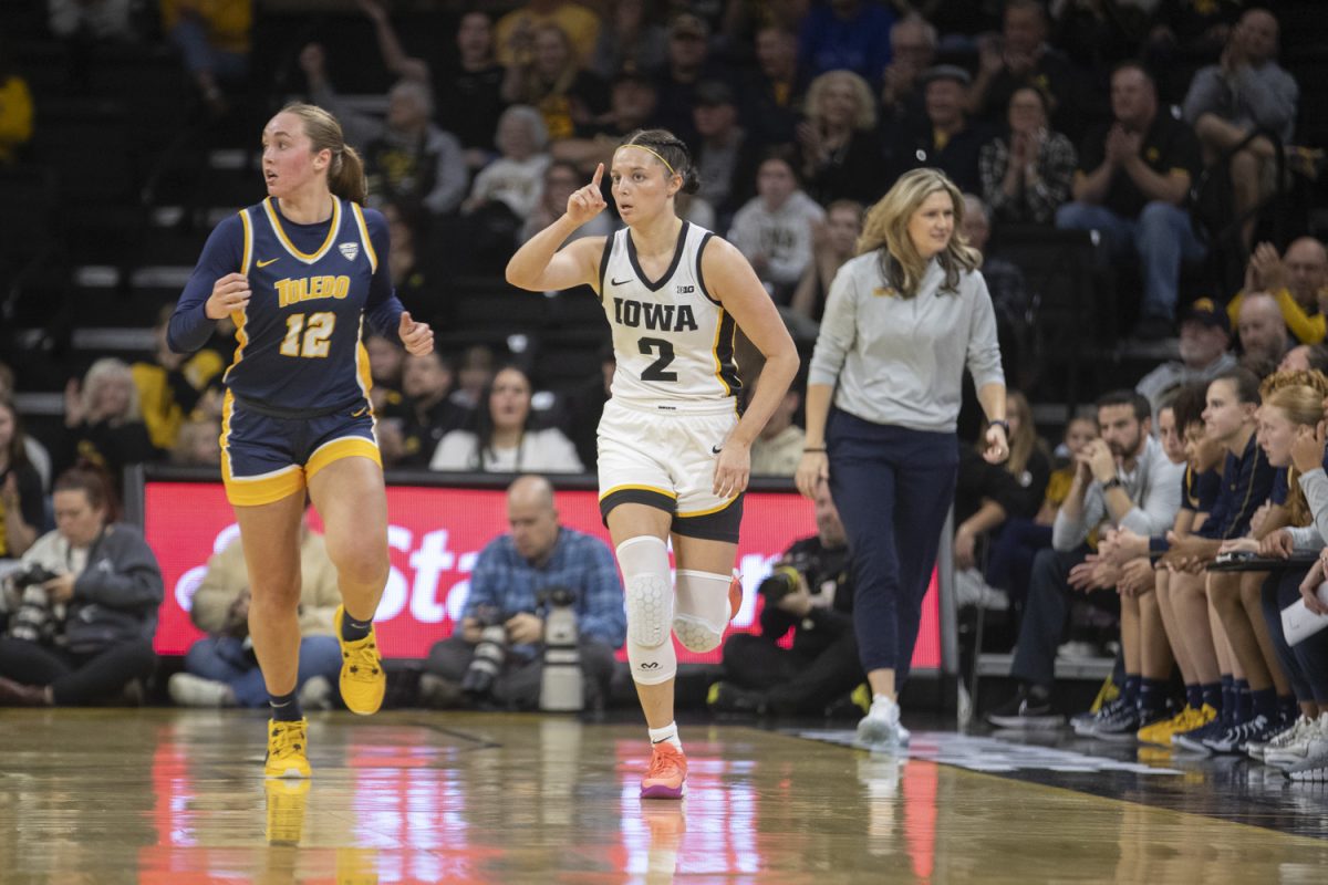 Iowa guard Taylor McCabe gestures after hitting a three-point shot during an Iowa women’s basketball game at Carver-Hawkeye arena in Iowa City on Wednesday Nov, 13, 2024. The Hawkeyes defeated Toledo 94-57.