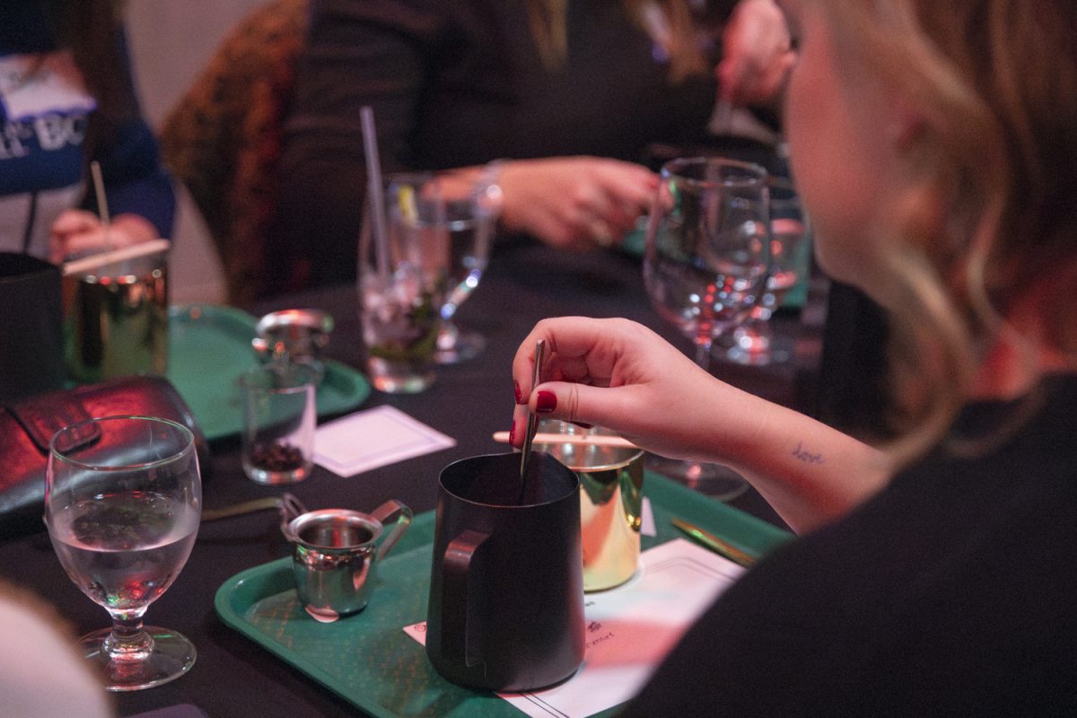 An attendee mixes their candle at Vue Rooftop in Iowa City on Tuesday, Nov. 14, 2024. Vue Rooftop hosted a Candle Pour Bar with Tura Lura Co., where attendees created their own custom candles.